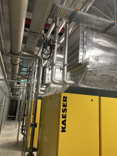 Yellow Kaeser compressors with silver heat exchangers
